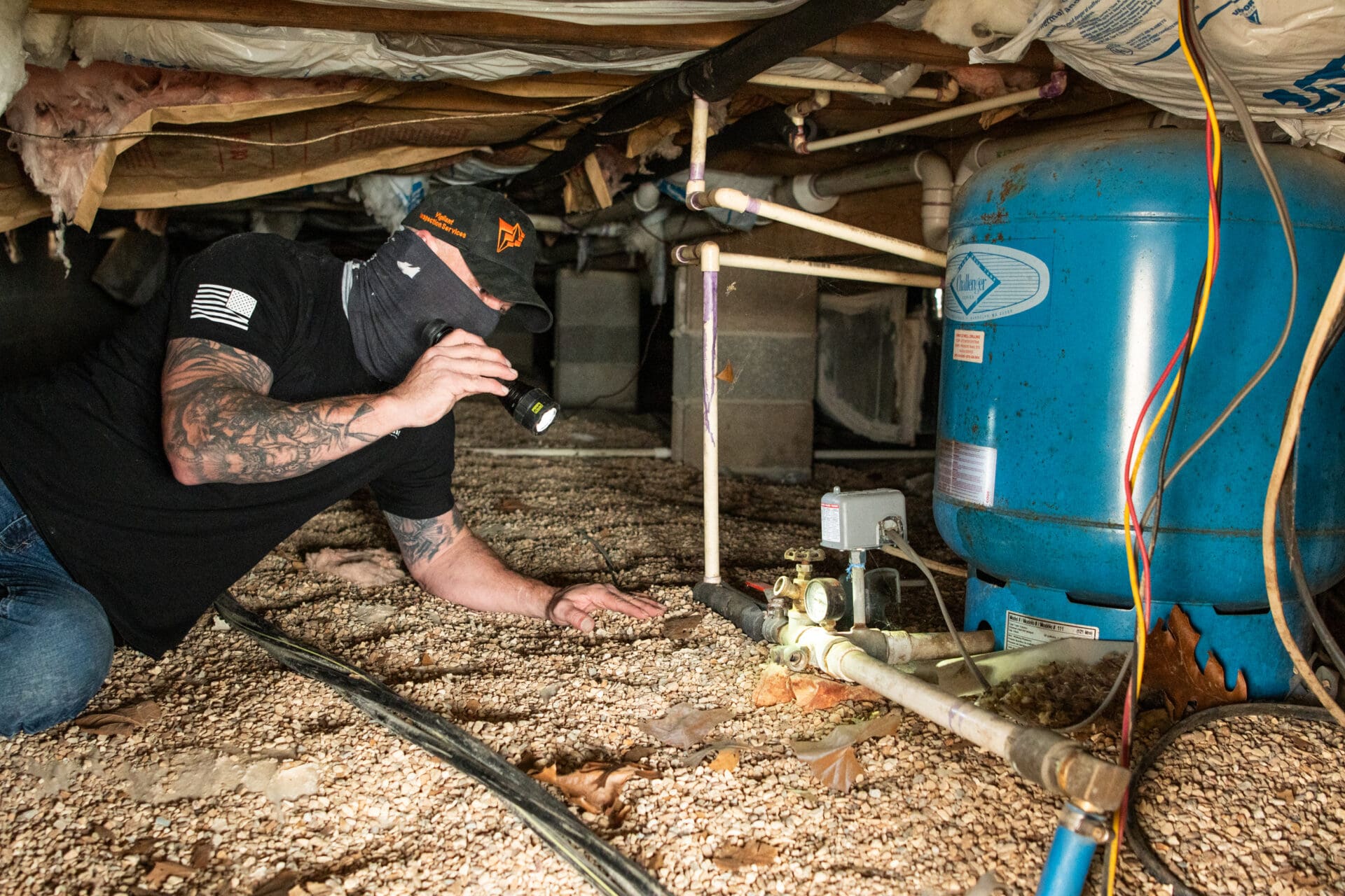 Home Inspector Performing a Home Inspection in a Crawl Space